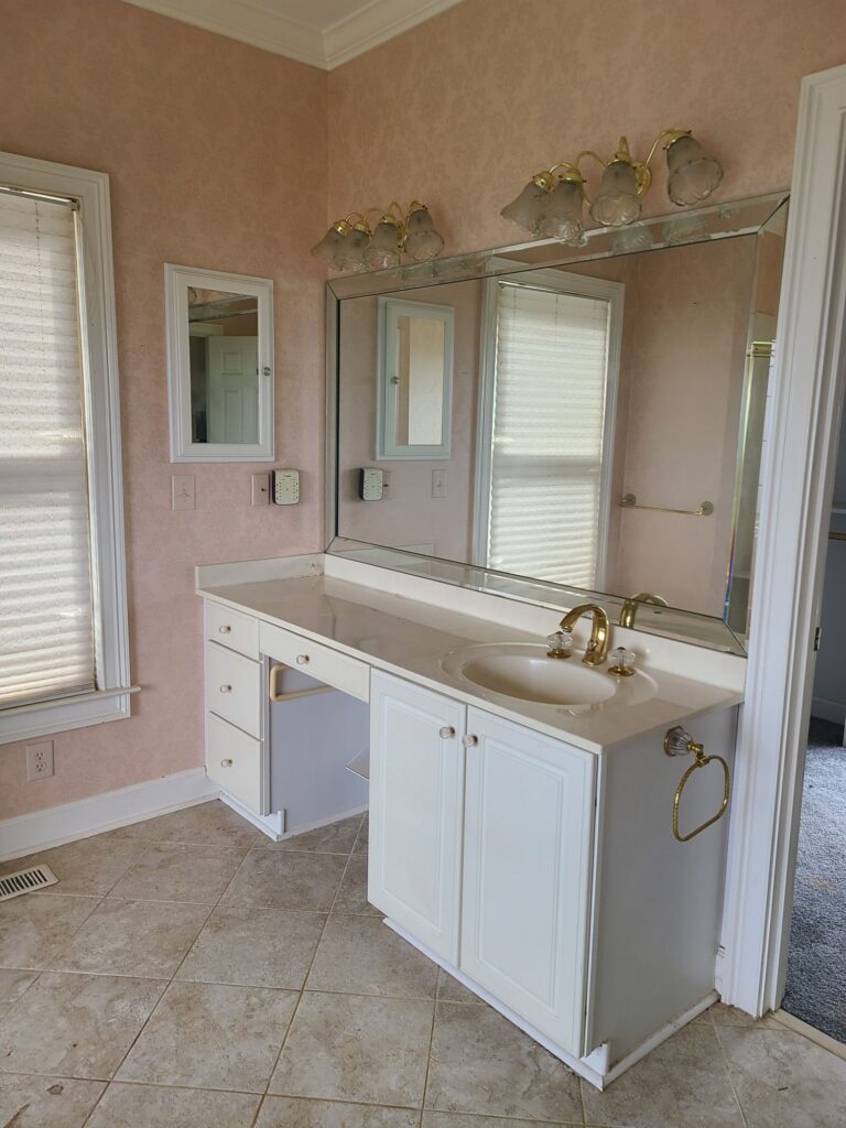 Original primary bathroom vanity and mirror