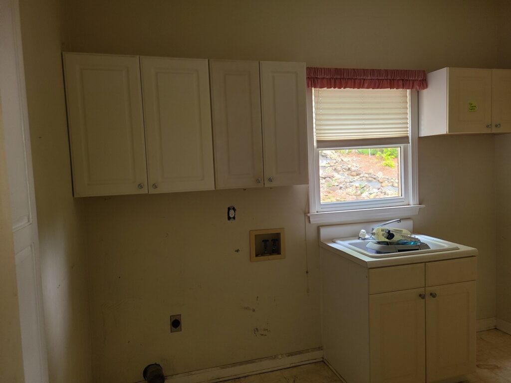 Original laundry room cabinets and sink