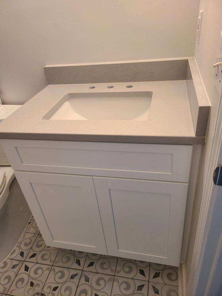 New white shaker vanity with quartz top
