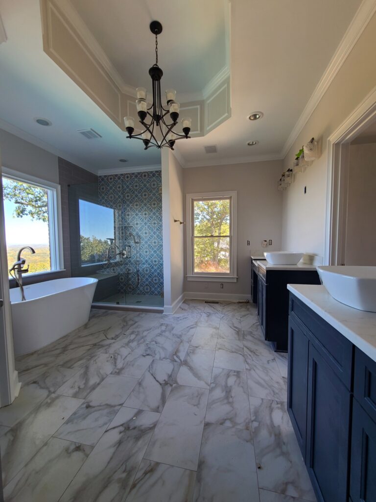 Primary bathroom with freestanding tub and mountain view