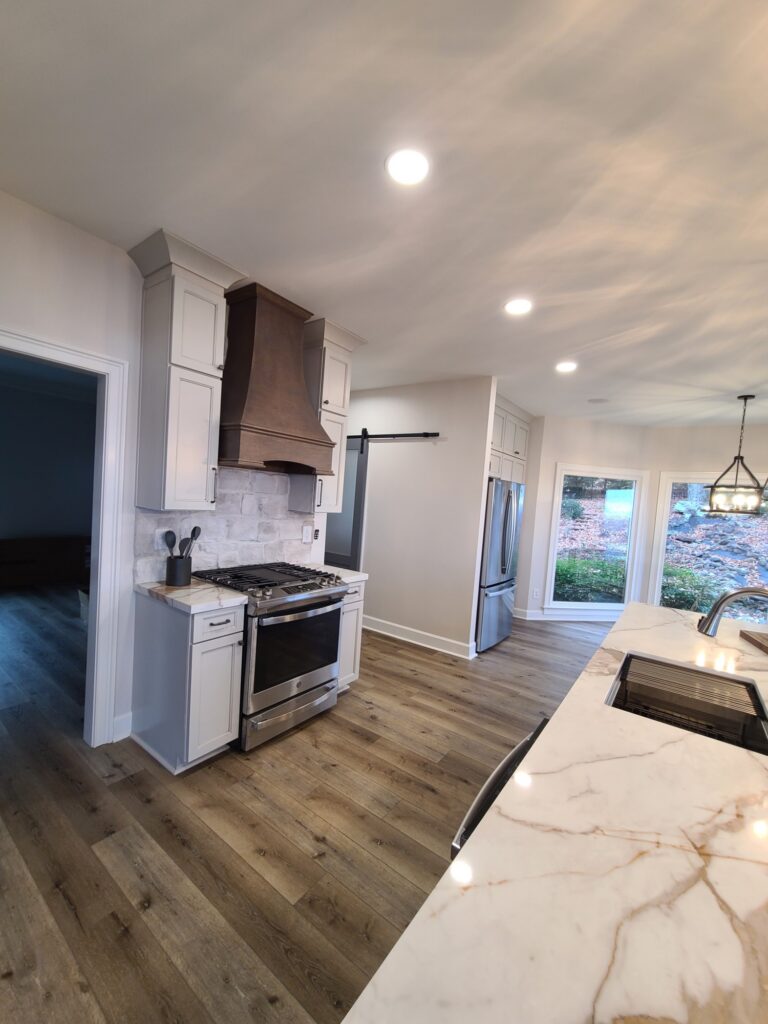 Range wall with wood hood and barn door